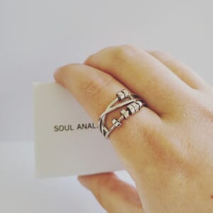 Fidget-anxiety-fidget-ring-worn-on-finger-holding-a-Soul-Analyse-box