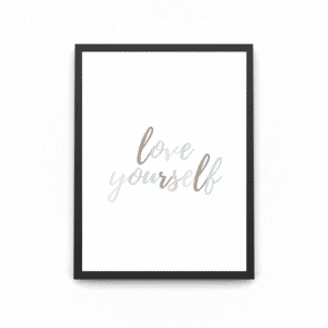 A black wooden art poster which states ' Love yourself'
