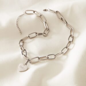 Photo of Silver loved chain necklace placed on a cream cloth