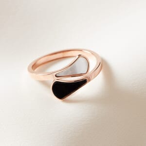 Rose Gold Yin Yang adjustable ring placed on a cream cloth